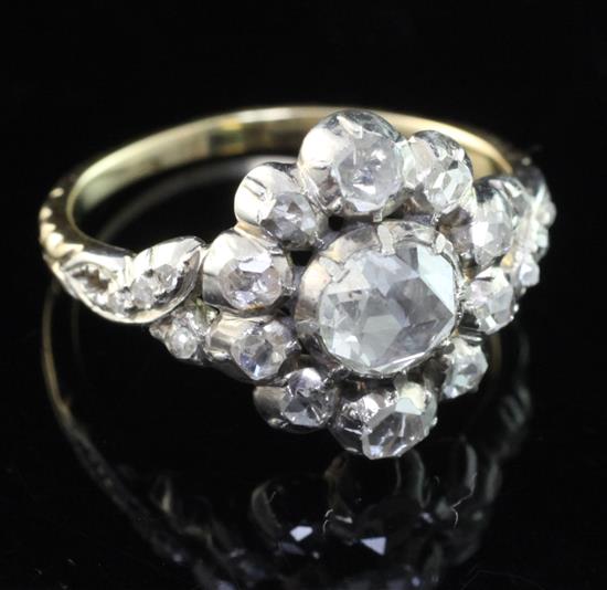 An antique style gold and silver, diamond cluster ring, size O.